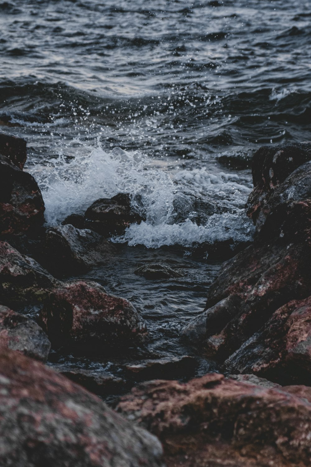 a rocky shore with waves crashing