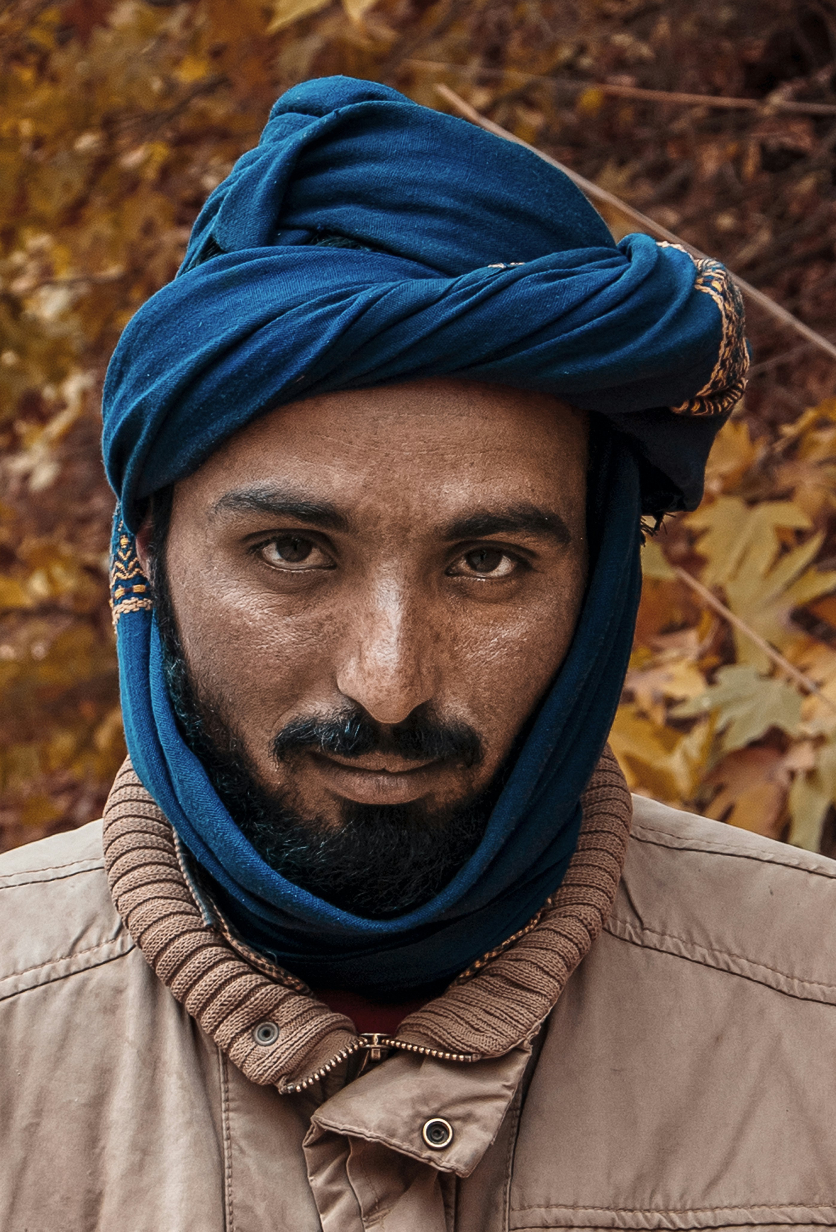 A man wearing a blue head scarf photo Free Autumn Image on Unsplash