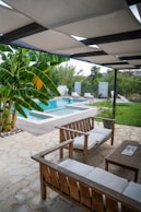 a pool with chairs and a table