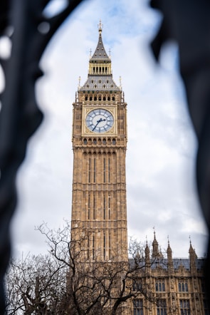 A refined image capturing the classic silhouette of Big Ben against a sterling silver morning light.