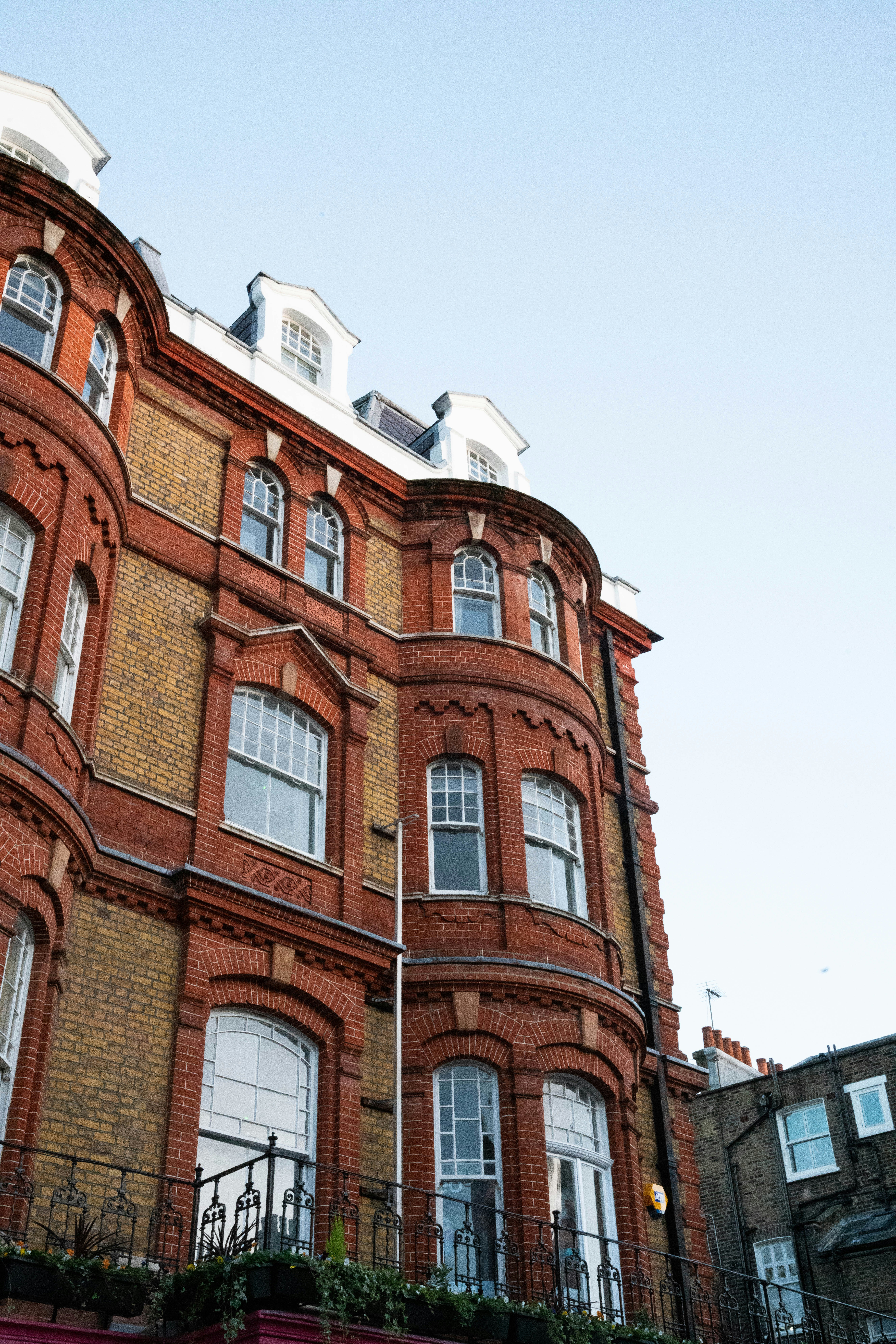 a brick building with a fence