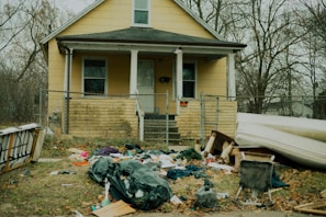a house with a yard and garbage
