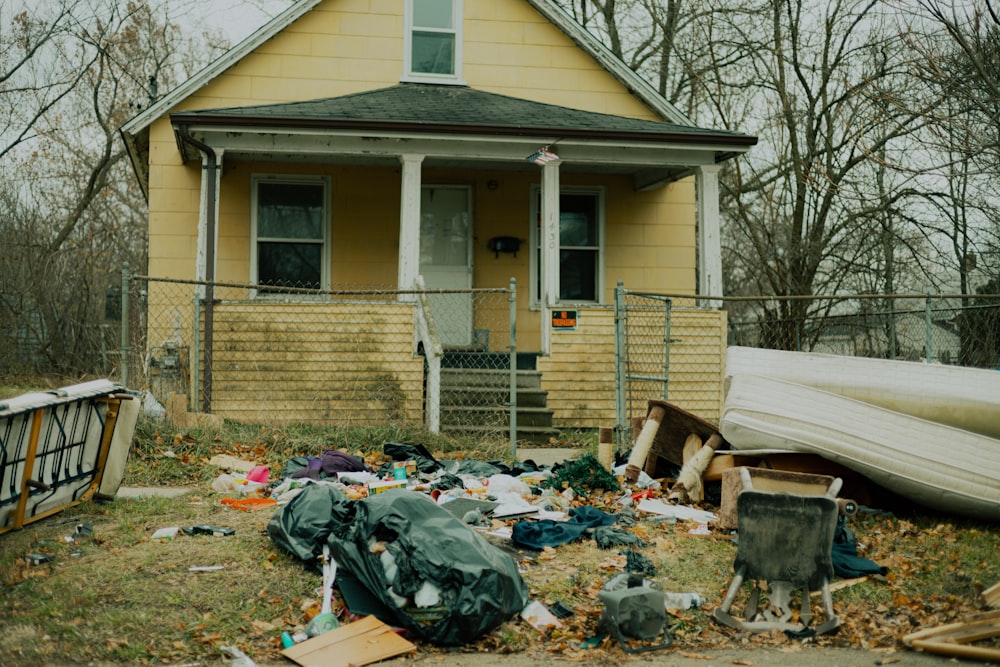 a house with a yard and garbage