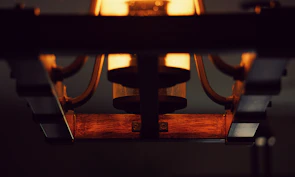 Close-up of handcrafted metal lighting fixtures showcasing detailed metalwork.