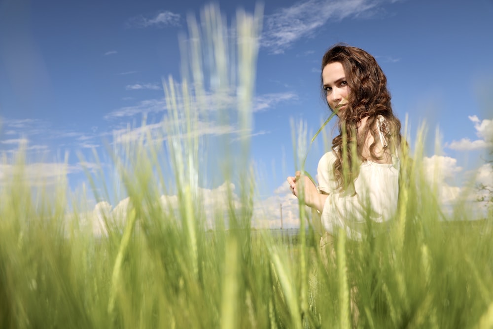 a person in a field of tall grass
