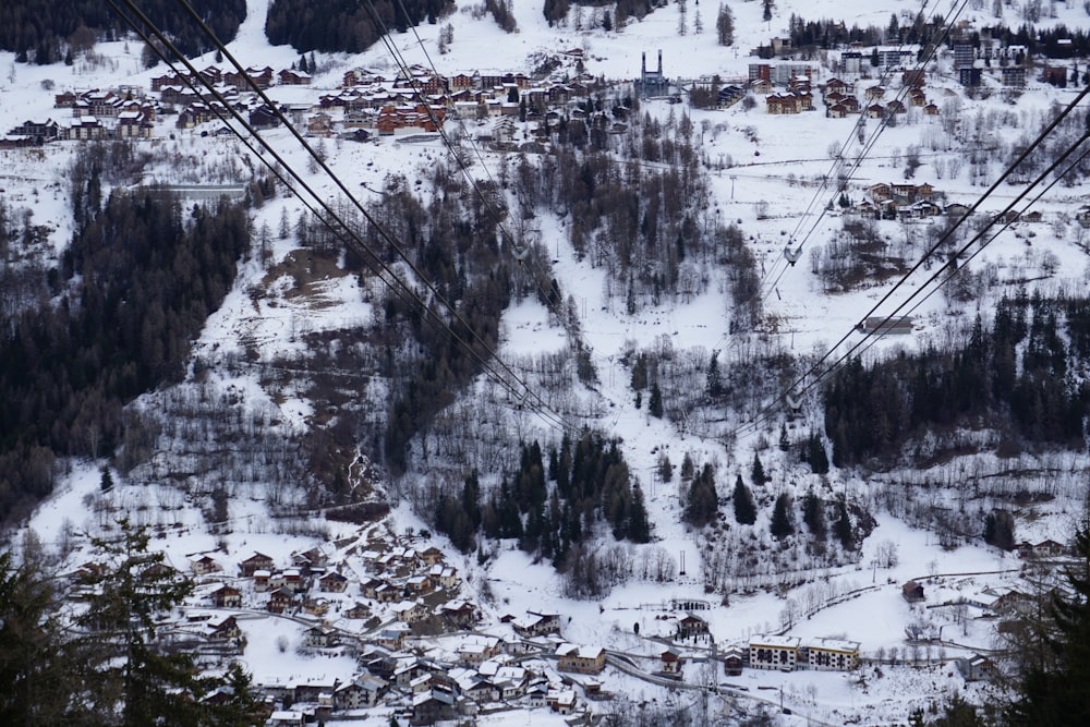 a snowy town with a ski lift
