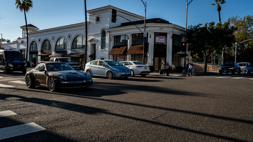 a group of cars parked in front of a building