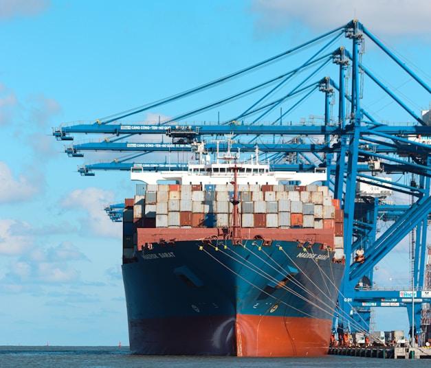 a large cargo ship at a dock