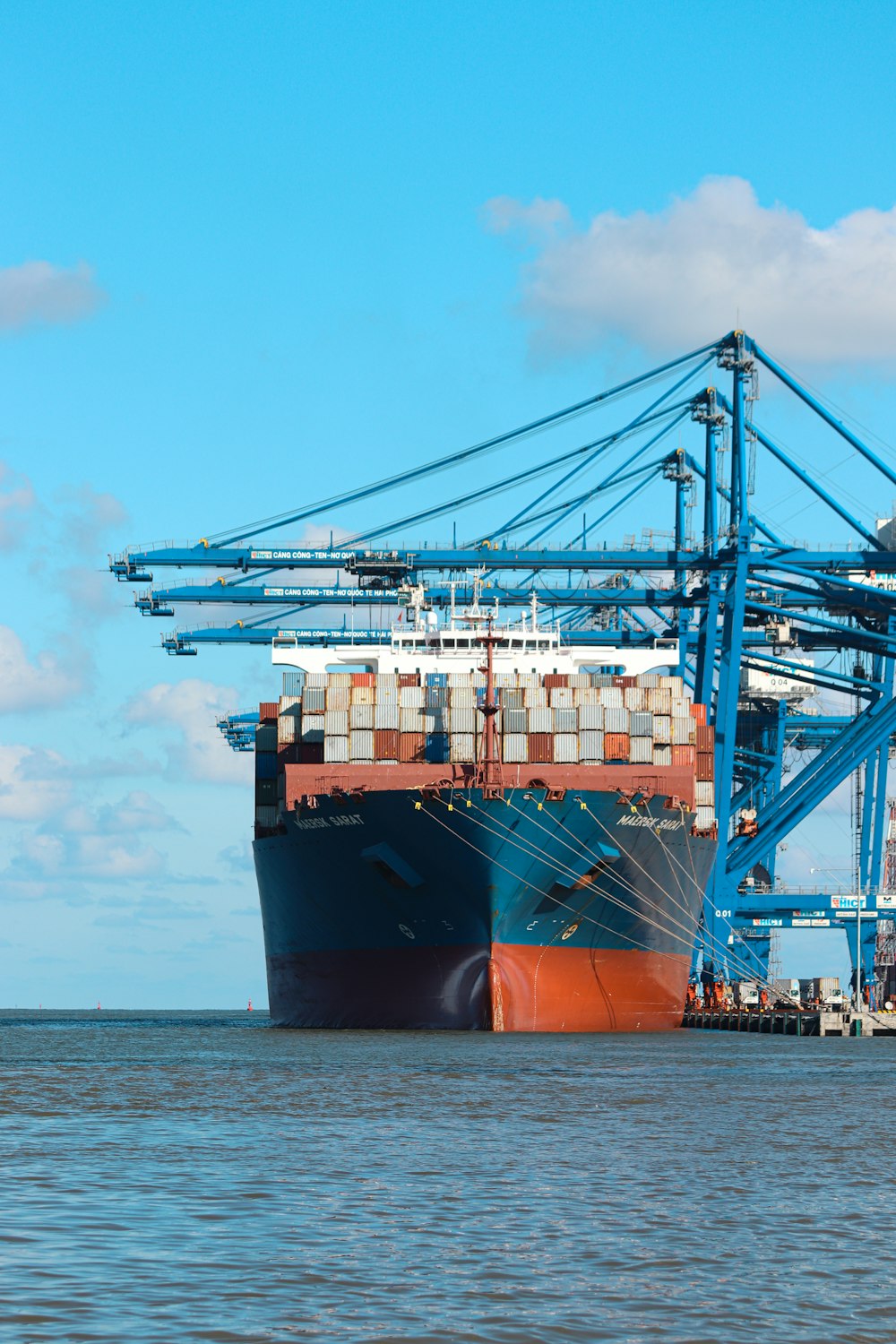 a large cargo ship at a dock