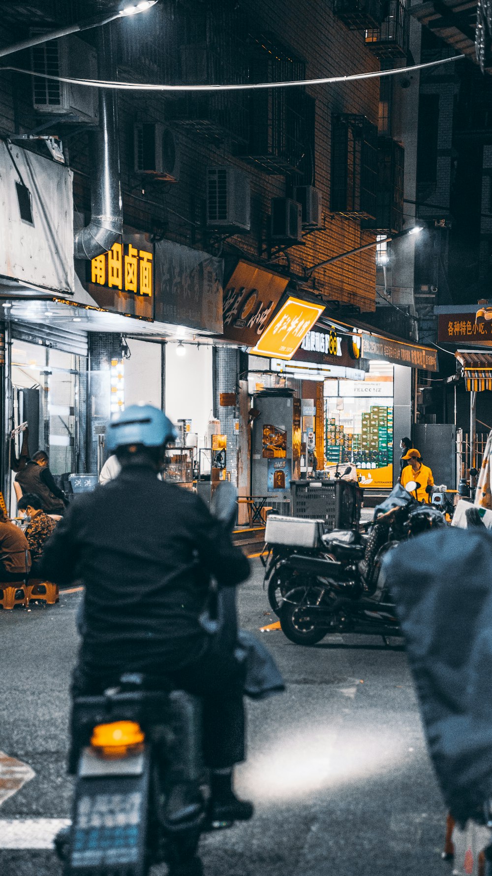 a person riding a motorcycle down a busy street