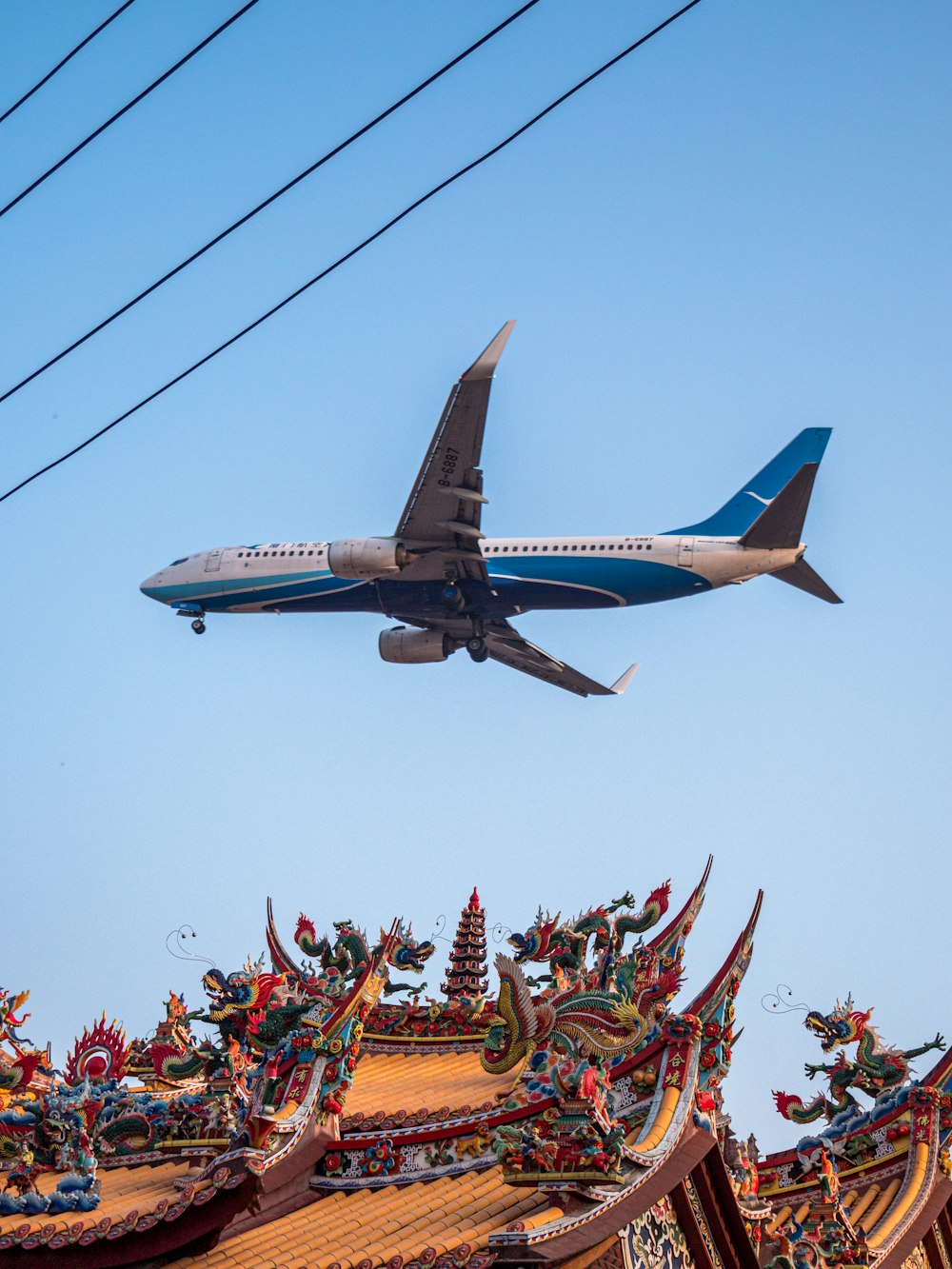 an airplane flying over a carnival