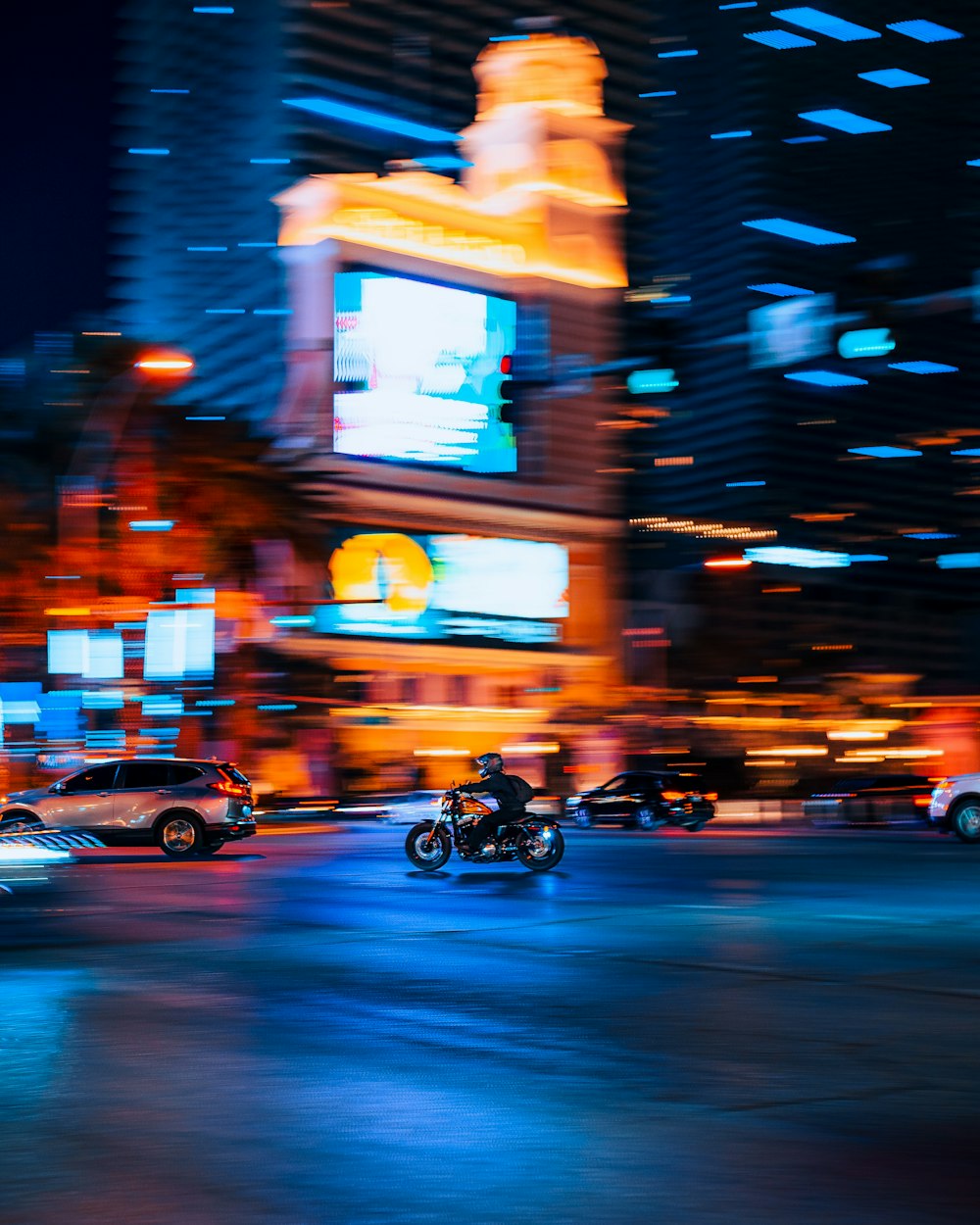 a person riding a motorcycle in the city