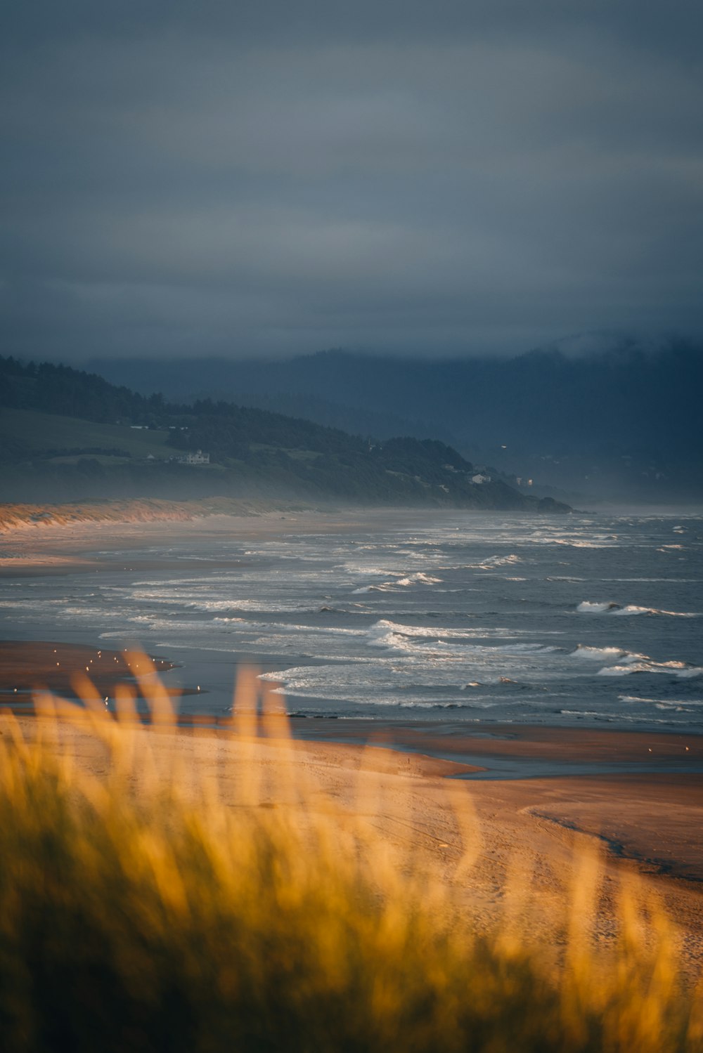 a beach with waves crashing on it