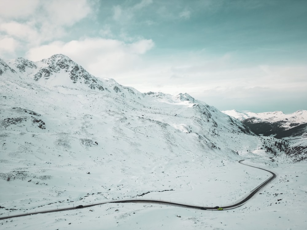 a snowy mountain with a rope