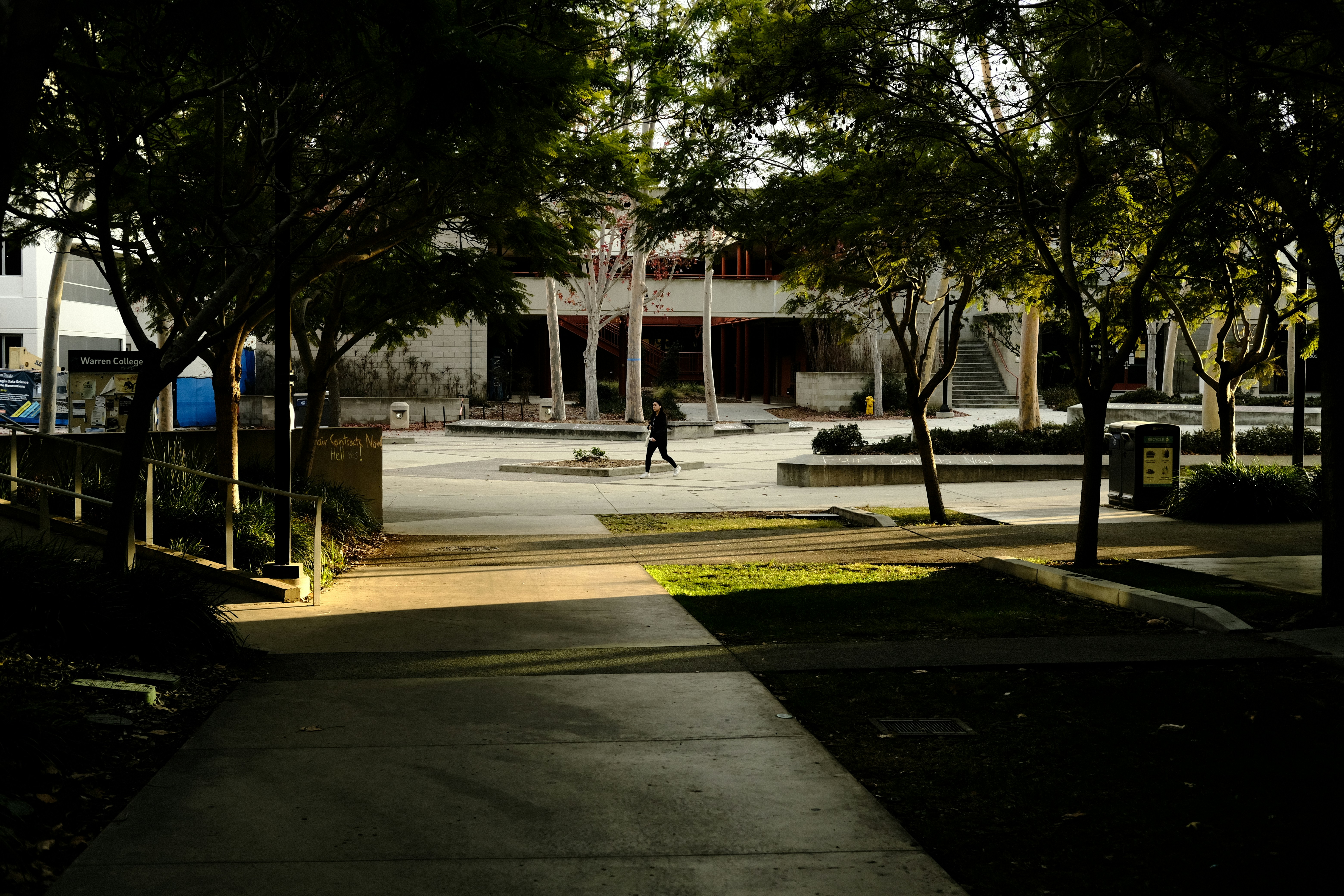 a person walking on a sidewalk