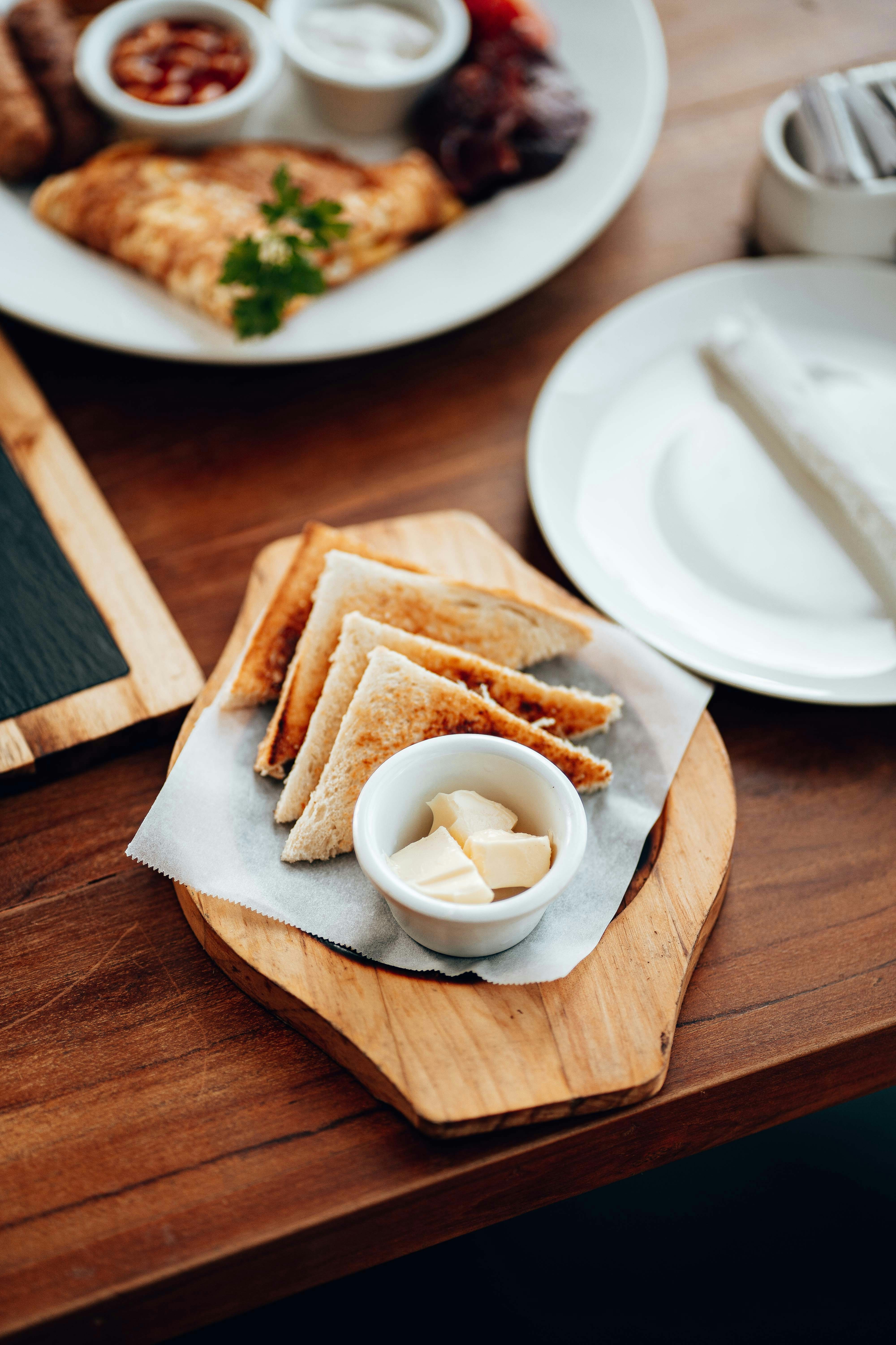 a wooden tray with food on it