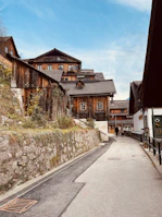 A rustic village street lined with colorful traditional houses.