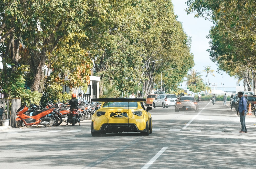 a yellow sports car on the street