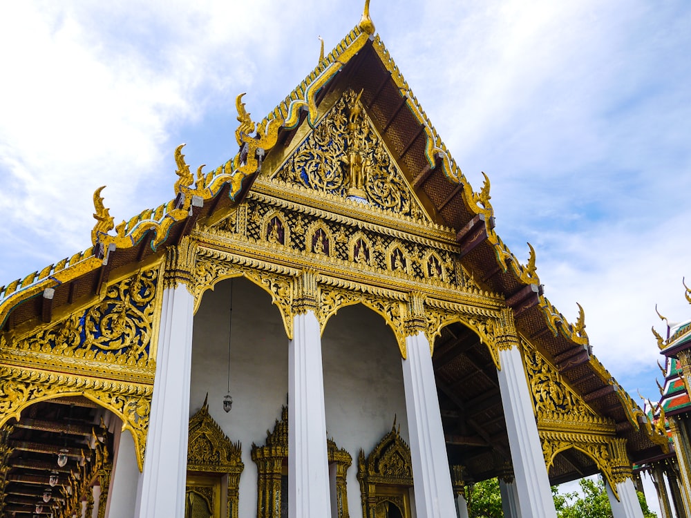 a building with columns and a gold roof