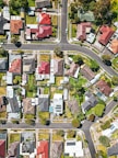 An aerial view of a vibrant residential neighborhood with well-maintained homes and green spaces.