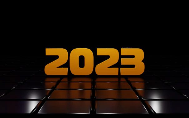 A clean, simple icon representing the year 2023 with a clickable arrow