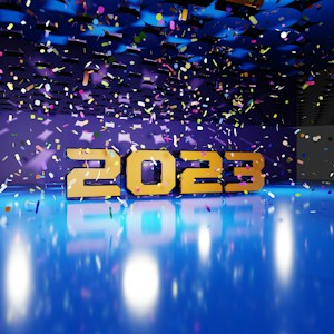 Large golden numbers displaying '2023' are positioned against a vibrant backdrop with a reflective blue floor. Multicolored confetti is suspended in the air, adding a festive and celebratory atmosphere. The background is a deep blue and purple, enhanced with lighting effects that give a party ambiance.