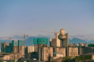 City skyline featuring large-scale infrastructure projects under construction.