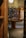 A cozy bookstore interior with shelves filled with books and office supplies under warm lighting.