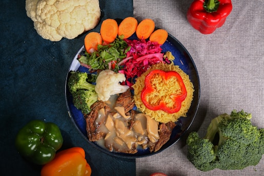 A vibrant plate of healthy, colorful foods representing the food sin diet.