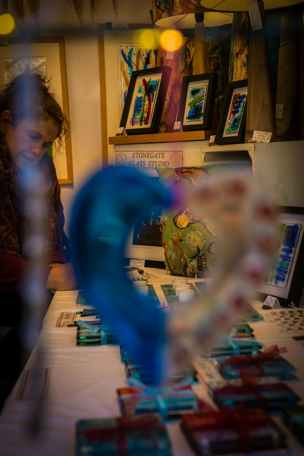 a person standing in front of a table with a bunch of cards on it