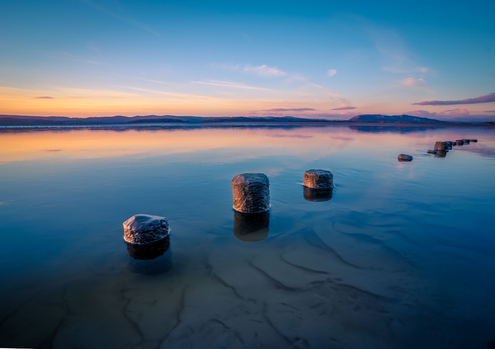 a group of rocks in the water