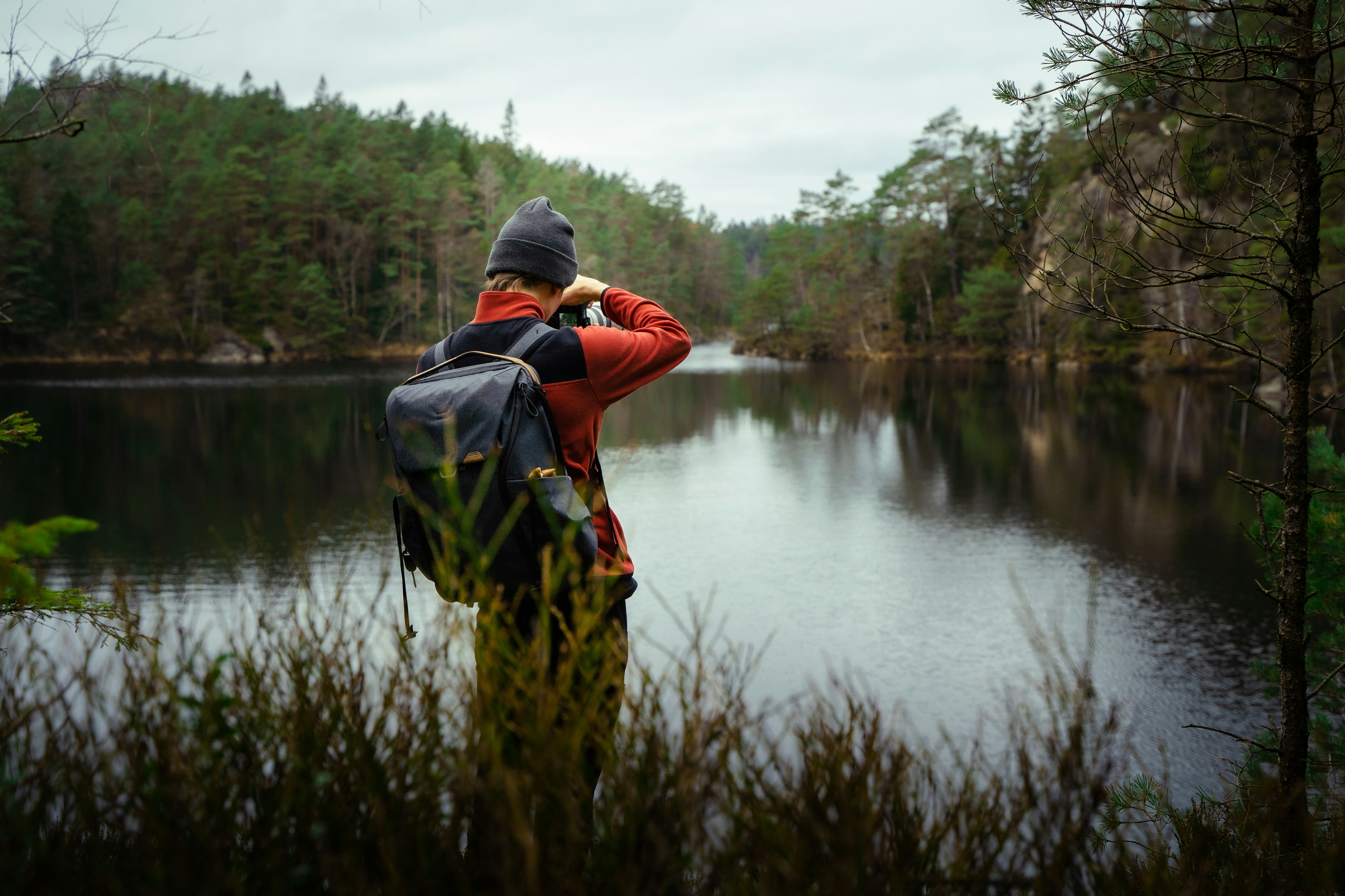 a person in a red jacket fishing