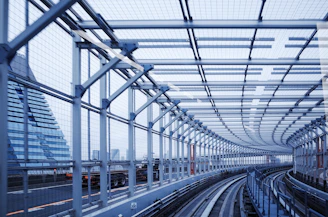 a train station with a large glass ceiling