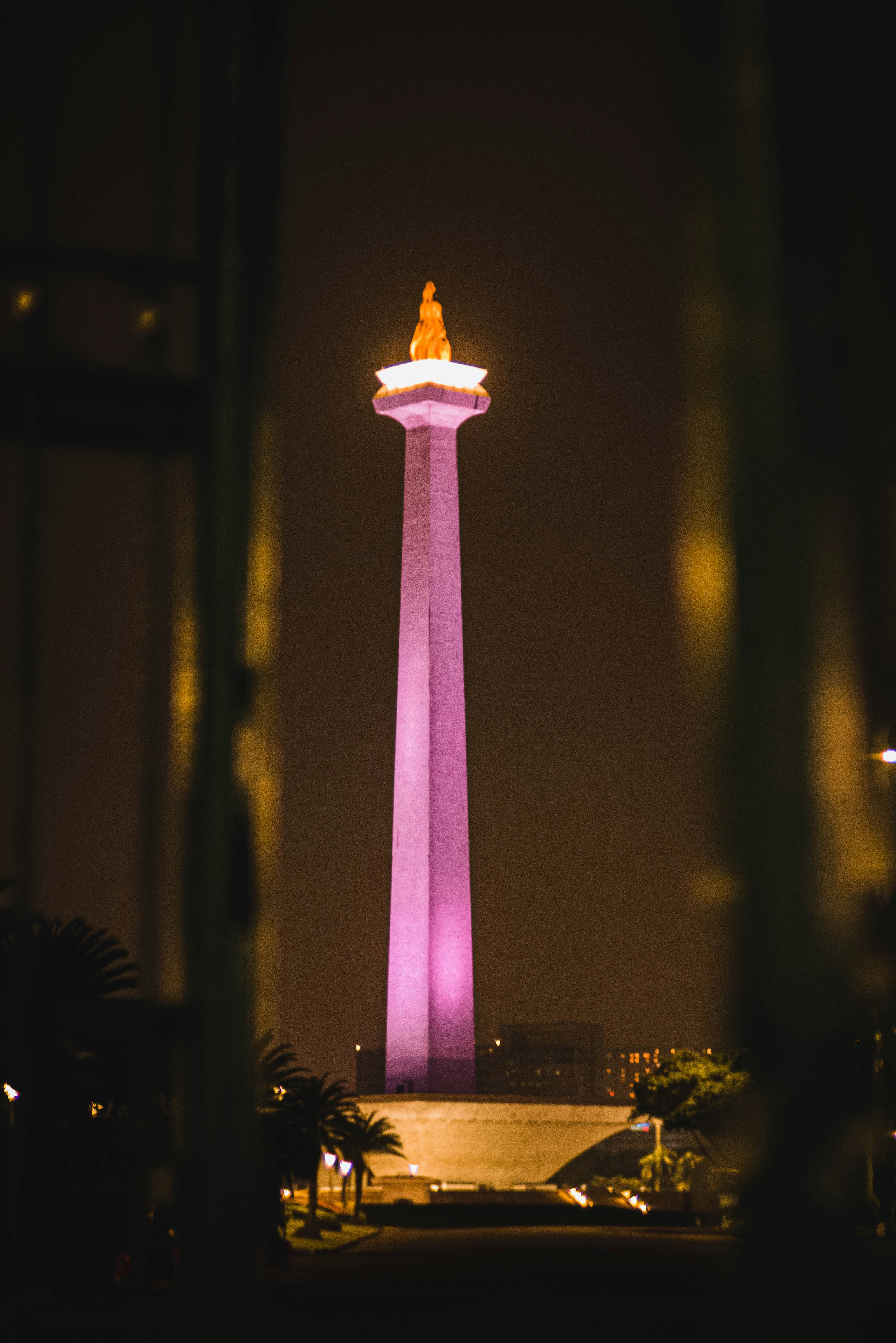 a tall tower with lights at night