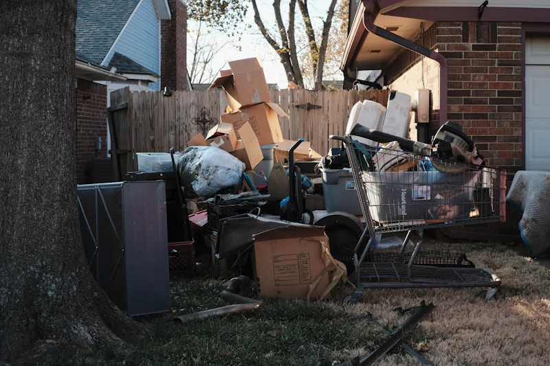 Pile of household junk left outside a house for removal