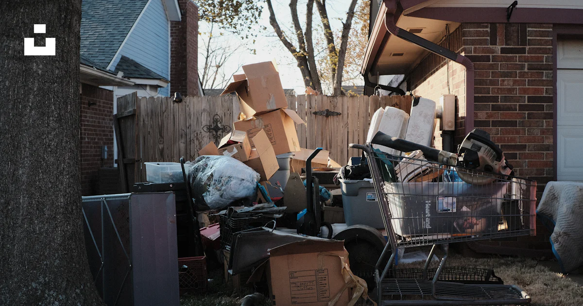 A pile of garbage outside a house photo – Free Grass Image on Unsplash