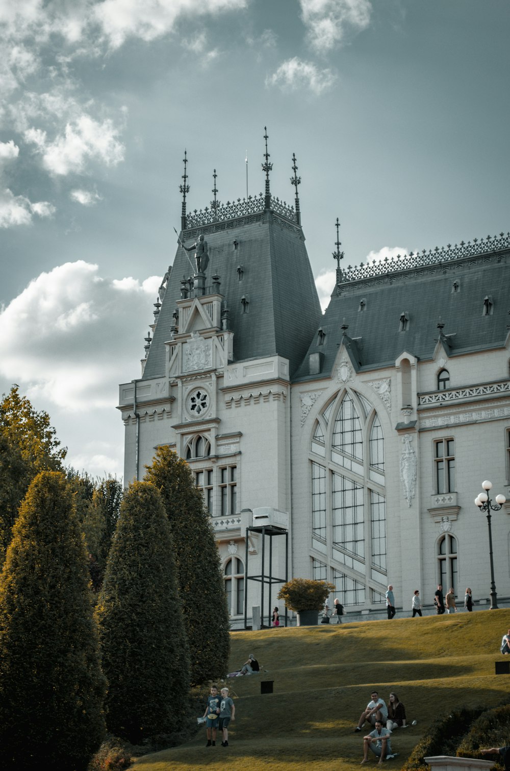 a large white building with a clock tower