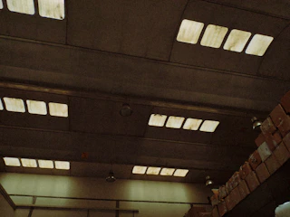 A sleek warehouse interior with stacked industrial goods under soft lighting.