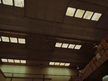 A sleek warehouse interior with stacked industrial goods under soft lighting.