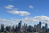 A sparkling clean office window reflecting the city skyline on a sunny day.