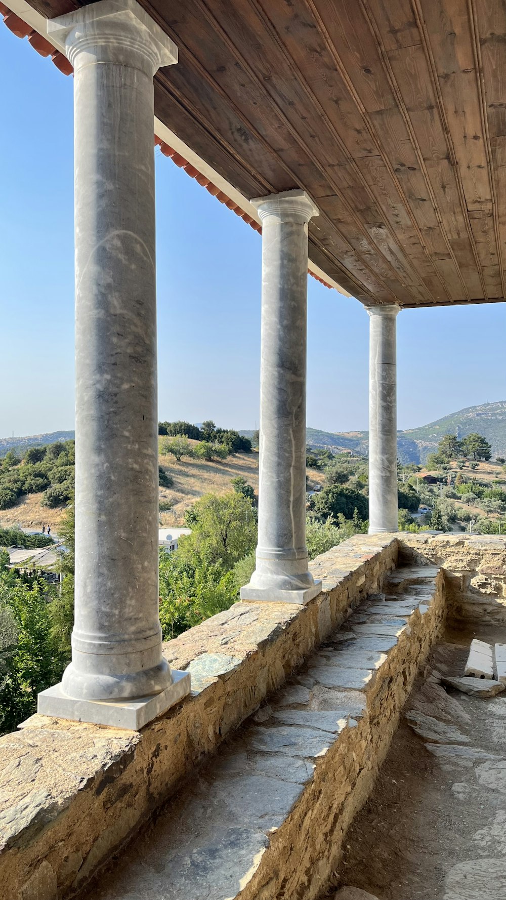 a group of pillars with water below