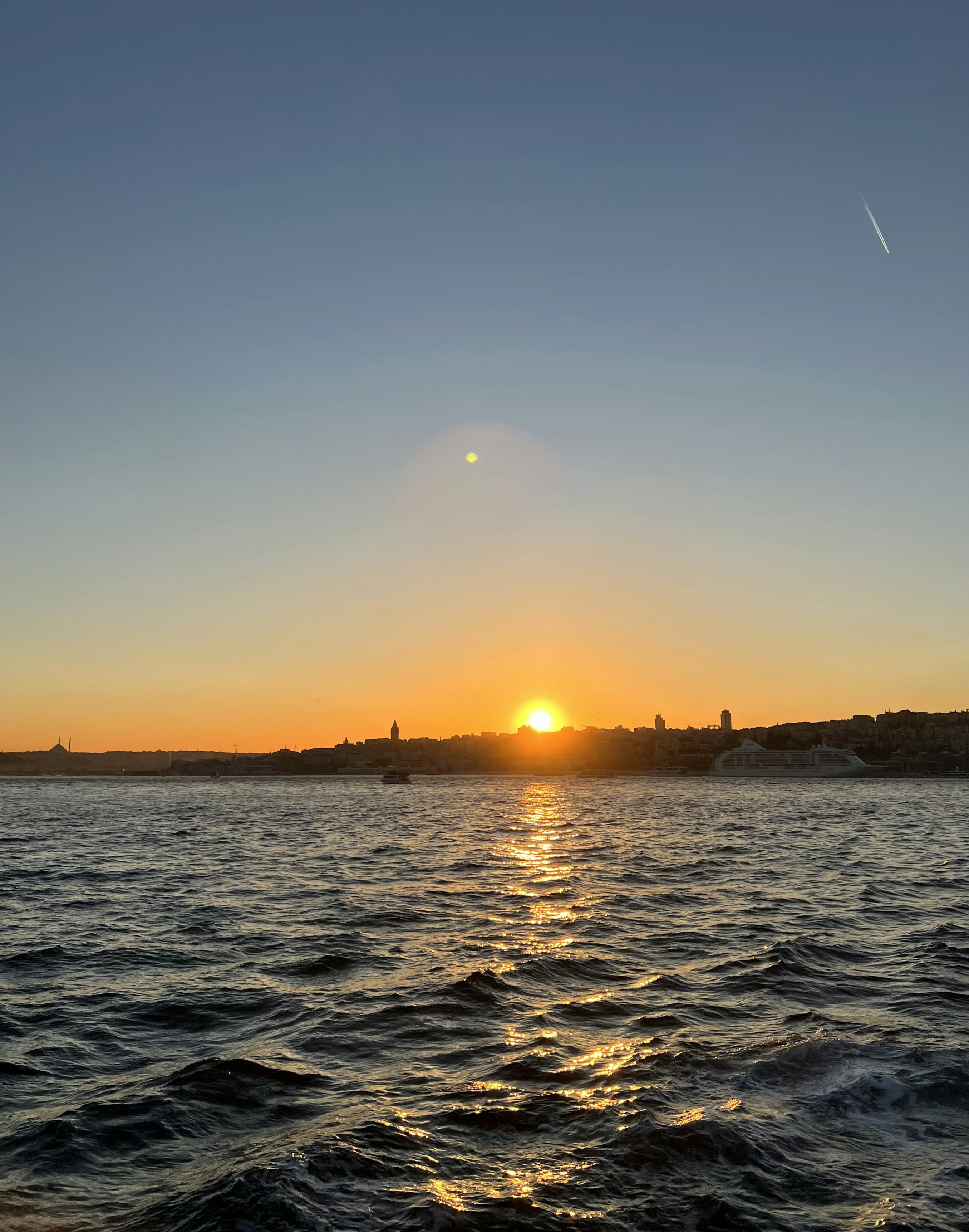 a sunset over a body of water