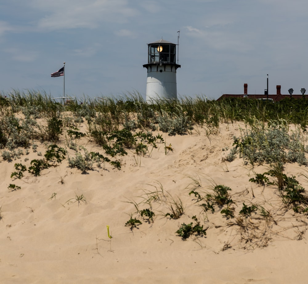 a lighthouse in the sand