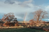 A calm sky after a storm with a rainbow over the countryside near Fürstenfeldbruck