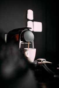 A sleek robotic arm expertly crafting a perfect espresso shot.