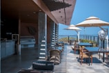 A panoramic view of a restaurant with a stunning outdoor dining area.