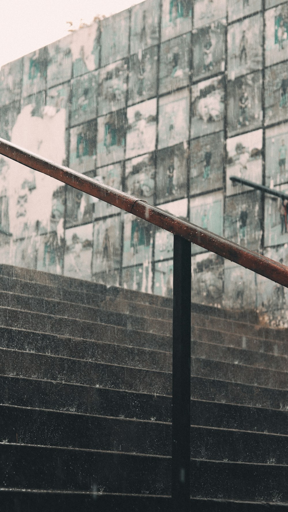 a brick building with a metal railing