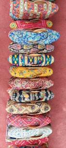 A vibrant collection of footwear in different colors and styles set against a colorful background.
