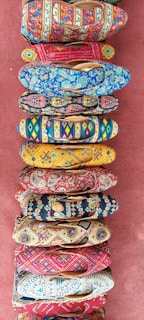 A colorful array of footwear arranged on a bright background.