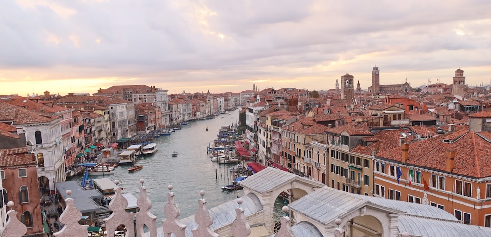 a city with many buildings and boats